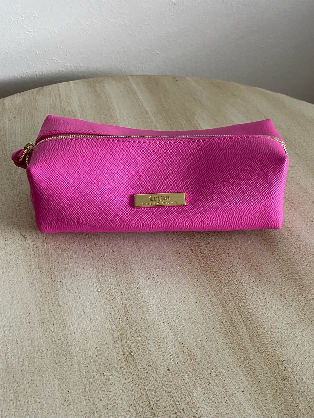 Trina Turk Hot Pink Saffiano Leather Cosmetic Bag structured loaf silhouette.